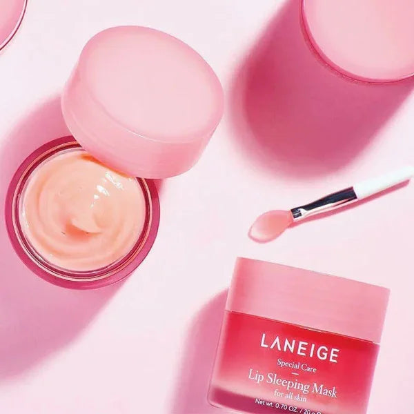 Laneige Lip Sleeping Mask in pink jar with applicator on pastel background, Korean skincare